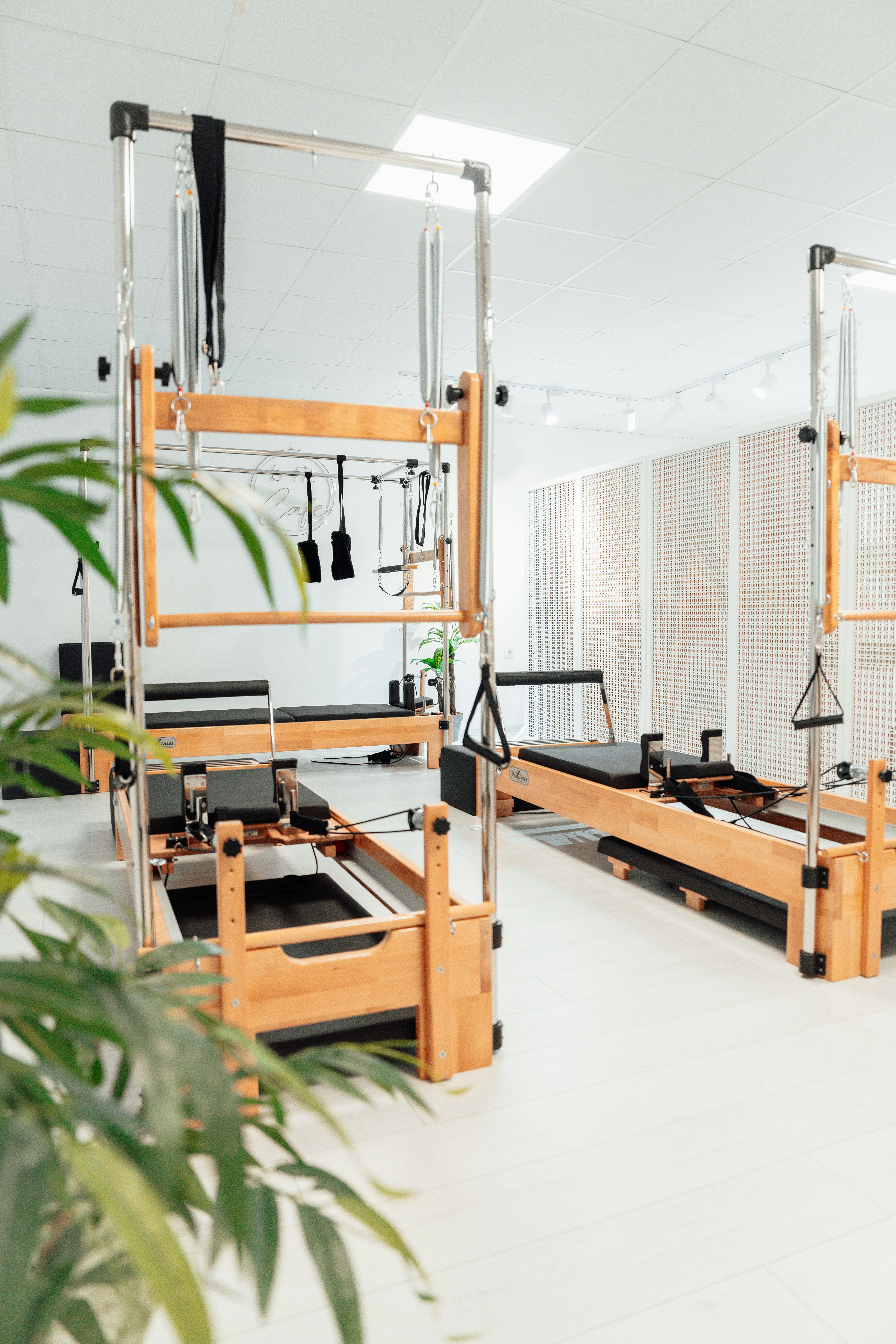 Modern looking Pilates space with working beds  